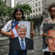 Protesters hold signs of Jeffrey Epstein and President Donald Trump in front of the Federal courthouse in New York City.